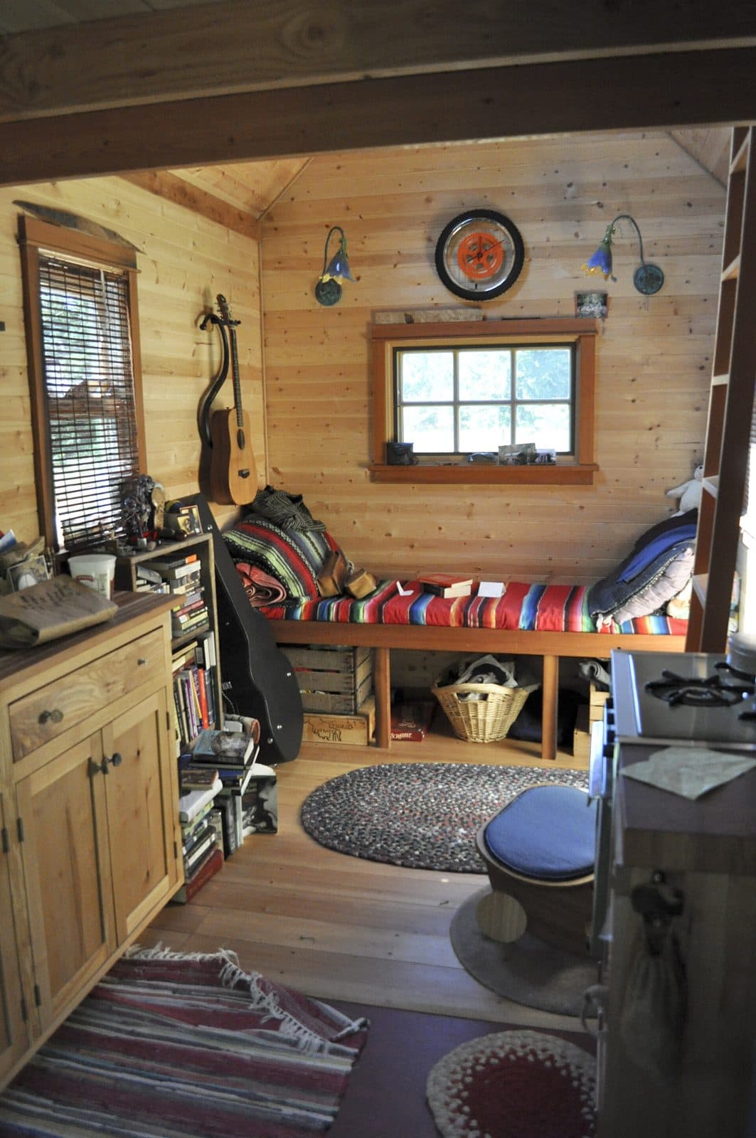 Tiny-house bench bed with storage underneath. Amenity reference, not an OPod.